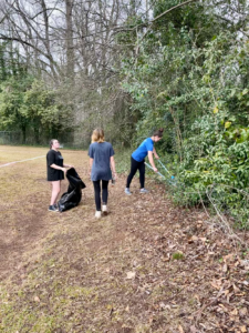 girls picking up trash