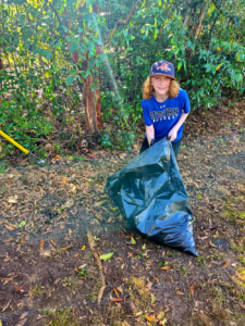 boy picking up trash