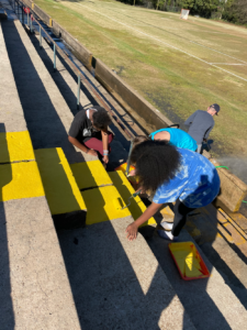girls repainting steps