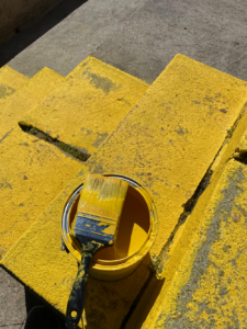 yellow paint on step